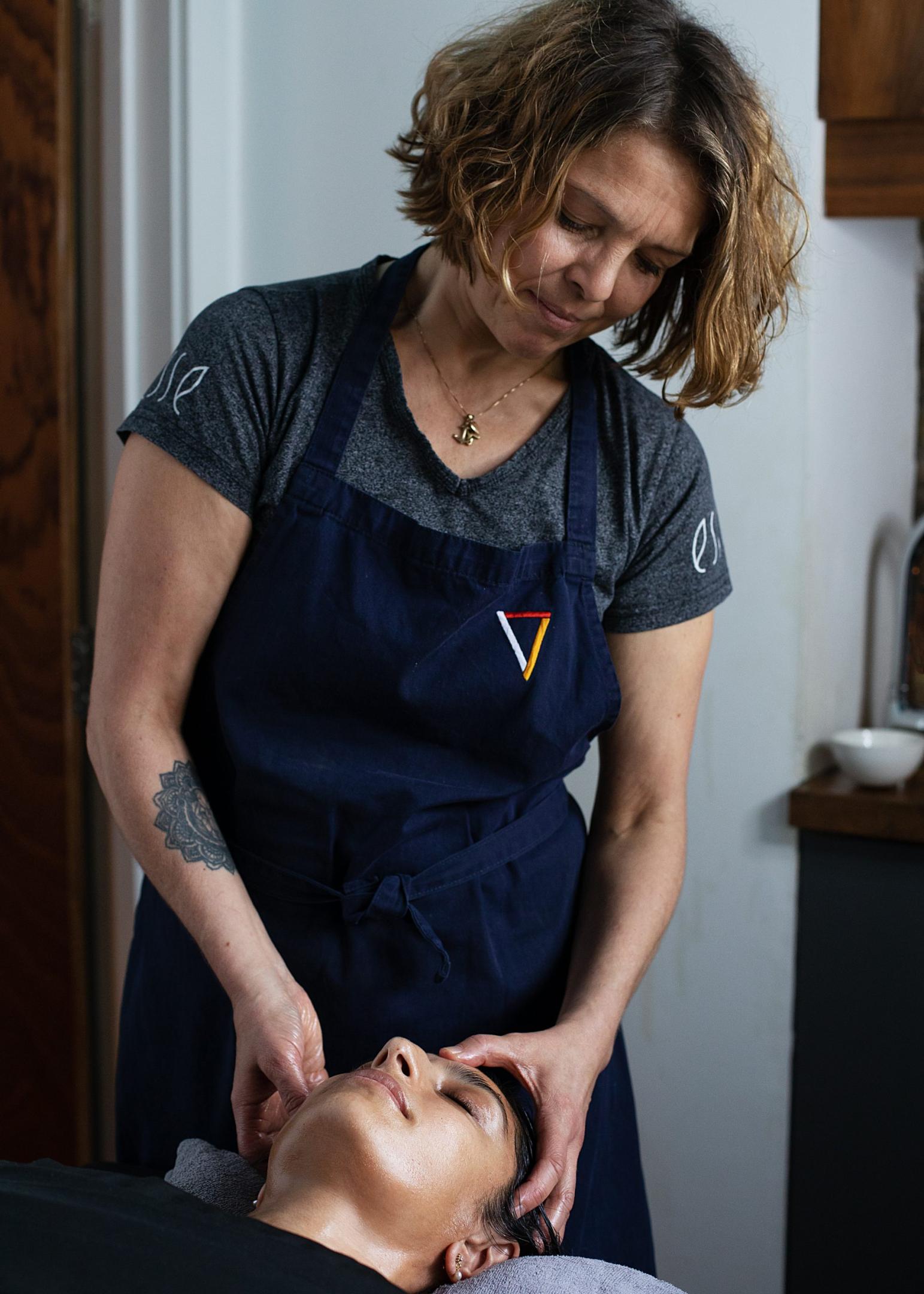 Anu massaging client's head
