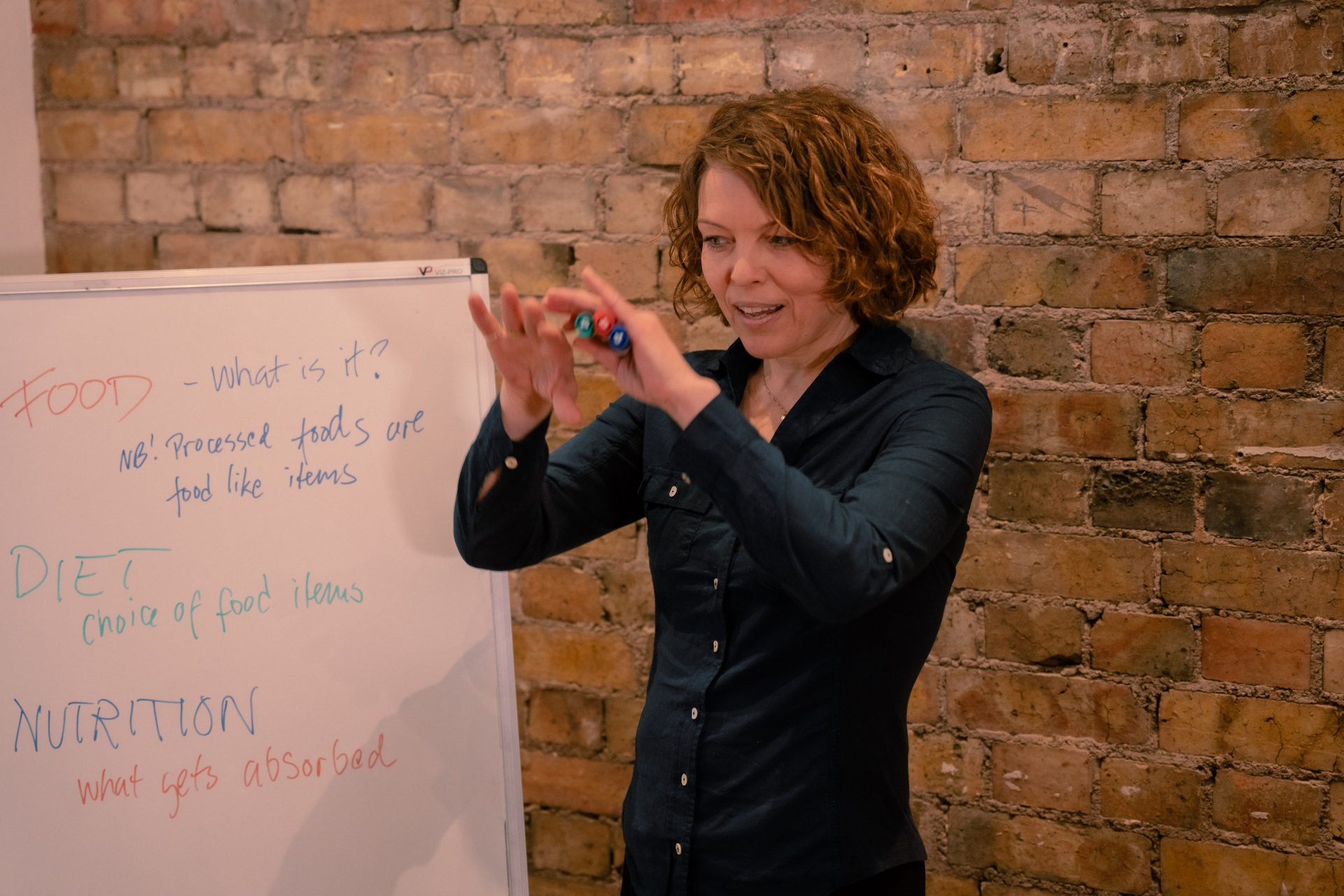 Anu teaching and gesticulating with hands