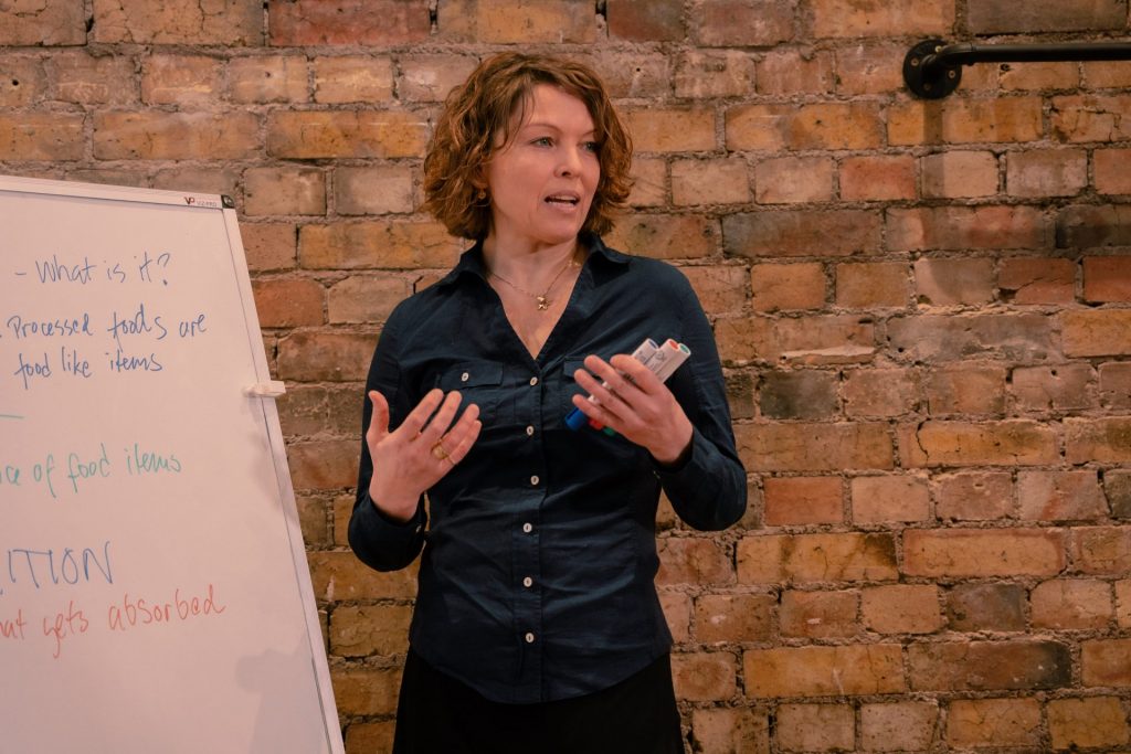 Anu Paavola, an ayurvedic practitioner and an educator talking to students