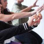Jivita Ayurveda Retreat, Morning Yoga session, people stretching arms