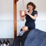 Anu Paavola, Ayurvedic practitioner, giving a shirodhara and Indian head massage at her ayurveda retreat in Dorset UK.