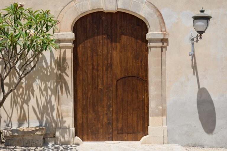 Wooden door to the retreat center in Sicily